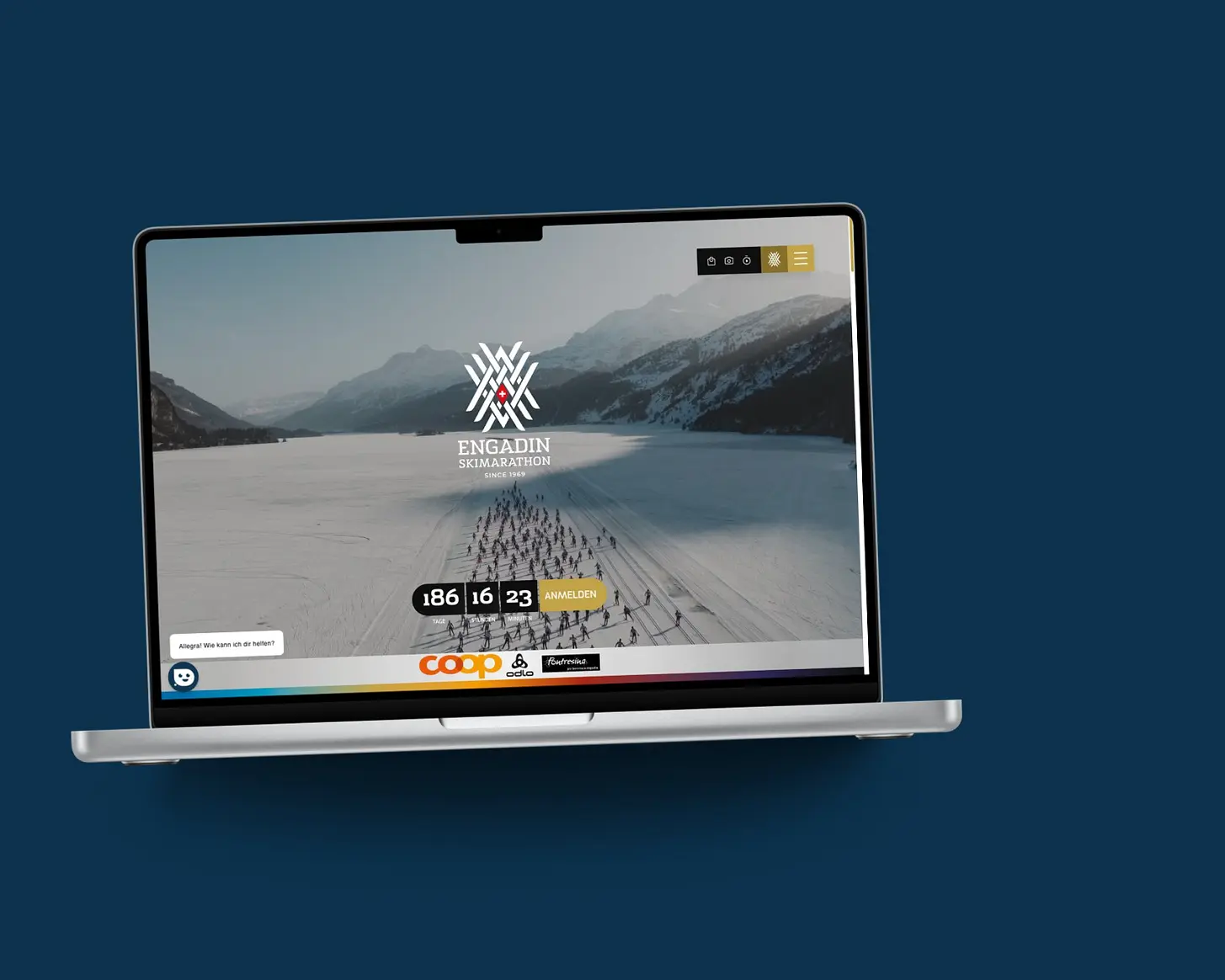 Startseite von ESM auf einem MacBook, vor einer Fläche in der Kundenfarbe